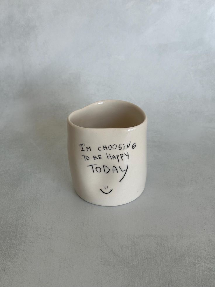 Handmade ceramic mug with hand-painted brushstrokes